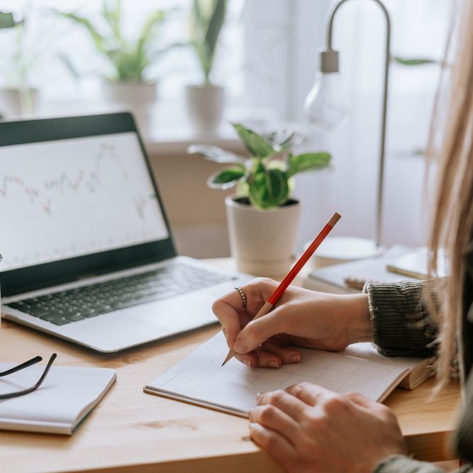 Hand writing at a desk